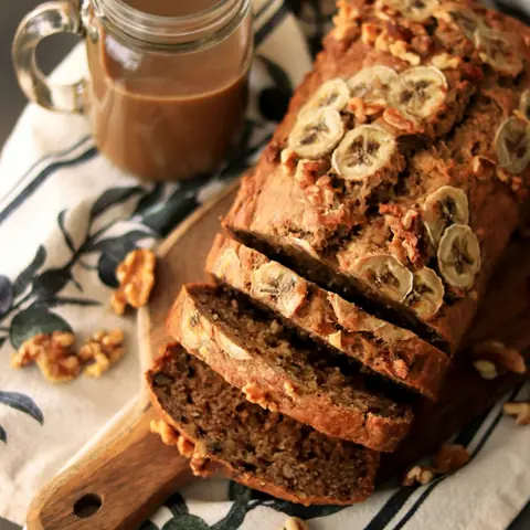 Sliced banana bread on a wooden board